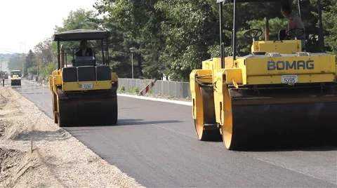 023 Road work. Paving. Asphalting. Road rollers flattens asphalt. Steamrollers. Stock Footage 41732217