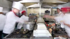 Time lapse of busy team of chefs preparing food in a commercial kitchen