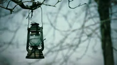 Old lantern hanging on the tree