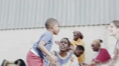 Happy little boy runs to hug a medical worker from a charity organisation