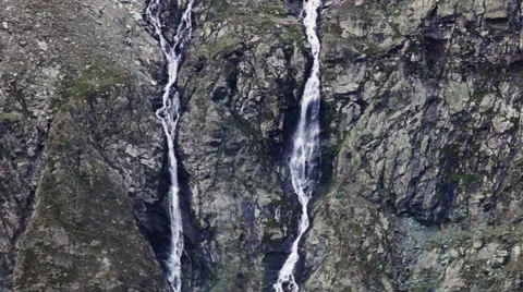 0252 Stream of water falling in Alps Mountain in Austria, Stream of water fallin Stock Footage 33758444