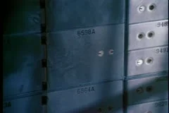 close-up of safe deposit boxes in a bank vault