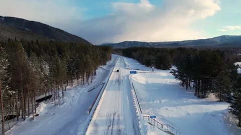 026  A car driving by the snow road. 库存影片 166344336