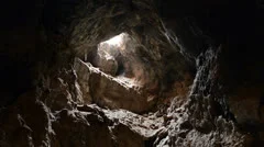 Light Rays Shine inside of Lava Tube Cave - 4K