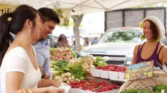 Young Couple Buys Strawberries at Farmers Market