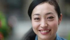 Portrait Asian woman smiling happy face people city