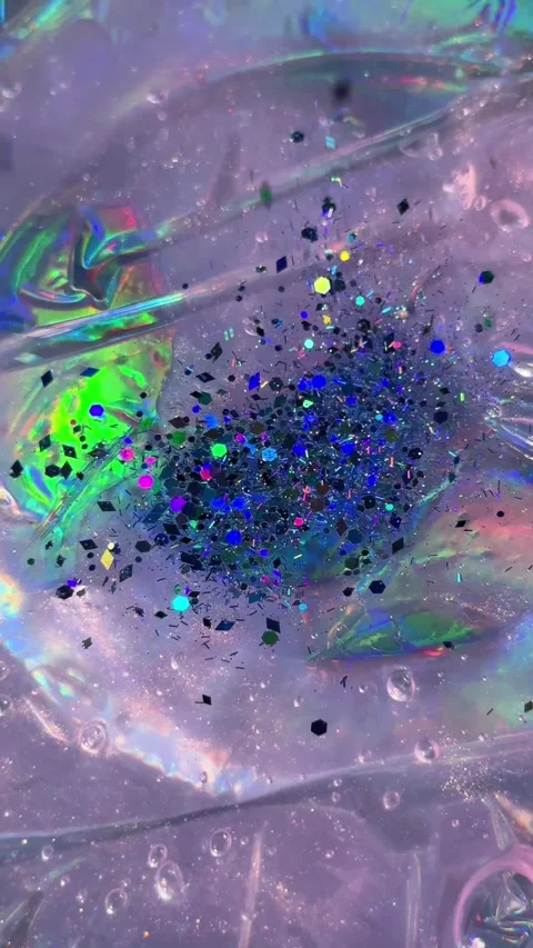 028_Iridescent slime with glitter macro shot.mp4 Video stock 342546408