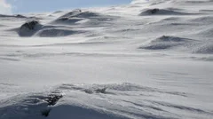 snow blowing on mountain top
