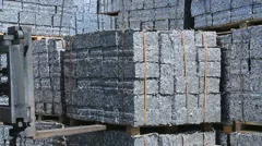 Forklift moves aluminum Scrap Cubes for recycling