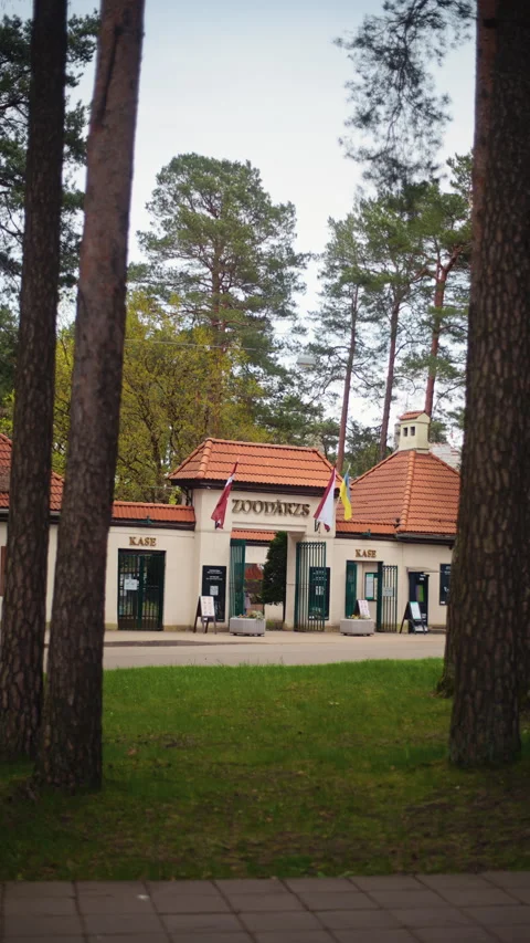 03 May 2025 - Riga, Latvia: A Stunning View of a Charming Building Nestled Among Vídeos de archivo 308335763