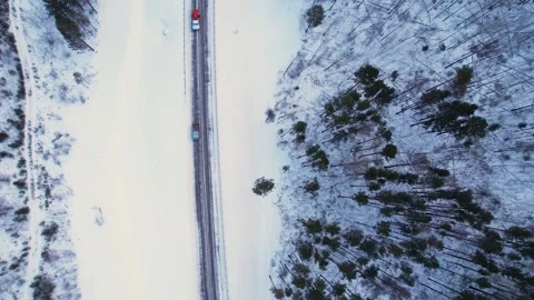 030  Cars driving by the snow road Stock Footage 166344334