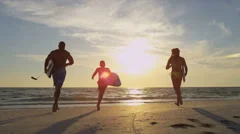 Ethnic Family Running Ocean Carrying Surf Boards