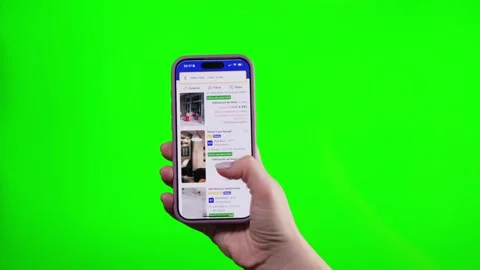 03.03.2025 Barcelona, Spain. Using app mobile Booking com for rental apartments Stock Footage 303354364