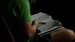 Scanning Bible at church, reading (young youth kid) (devotions)