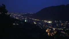 Lit mountain town in night