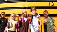 Students standing in front of school bus