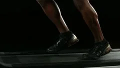 Closeup of athlete's feet running on treadmill
