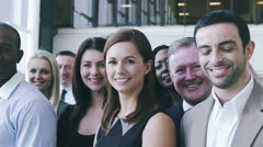 Portrait of a large business team. Content young business team smiling into
