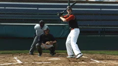 Baseball player hitting ball, slow motion