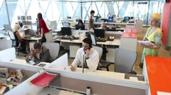 Customer services call centre team on telephones. High quality HD video footage
