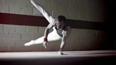 Gymnast floor work. Olympics sport in contemporary setting. Slow motion
