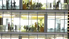 Time lapse of busy city office workers together in large modern office building