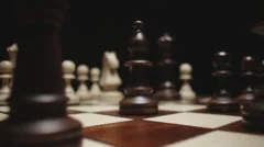 Stock video footage chess board and pieces travel through the close-up