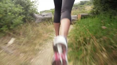 woman running trail close up shoes steadicam shot