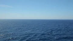 Ocean blue sky and tranquil water at sea with horizon