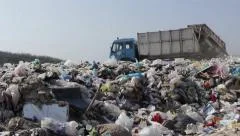 34/35 Garbage truck transported and disposed trash on the landfill, dump, 25fps.