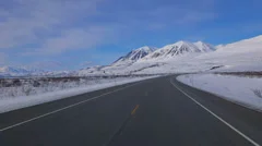 Driving Plate Forward POV Yukon Mountain Roads in Snow Country Canada