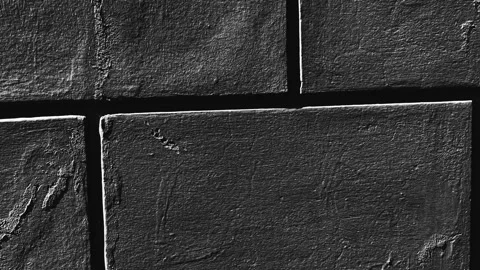 036_Rough dark stone wall texture.mp4 Stock Footage 346974212