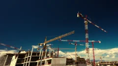 big construction site with cranes panorama timelapse pan and zoom motion