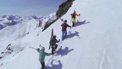 AERIAL: Skiers walking uphill