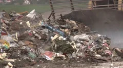 Truck moving garbage in a landfill site