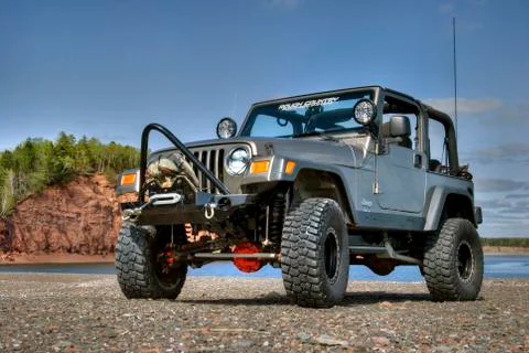 A lifted Jeep poses on the shoreline of the Bay of Fundy in Nova Scotia. xkwx Jeep, TJ, wrangler, 4x4, off-road, beach, four wheel drive, suv, nova scotia, canada, bay of fundy, shoreline