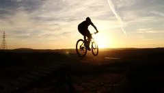 Slow Motion Silhouette Man Mountain Biking Off Extreme Jump