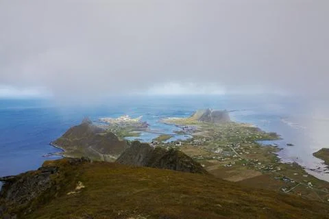 Scenic view of town Sorland on Lofoten islands in Norway on cloudy day xkwx arctic clouds island mist mountain north Norway norwegian Ocean panorama peak picturesque Scandinavia scenery scenic sea Sorland town Vaeroy view village
