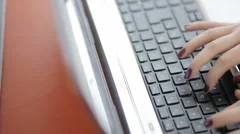 woman typing on laptop at work: businesswoman, manicured hands