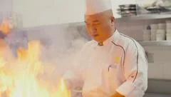 Asian restaurant kitchen, chinese chef cooking food, cook working