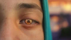 Teenager with futuristic robotic eye