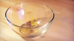 Pasta falling into the glass bowl