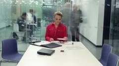 Timelapse of young attractive business group in a meeting in modern city office