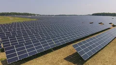Aerial Fly Over Large Commercial Solar Panel Farm Field