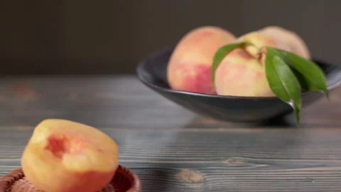 04 Cut Peach and Fresh Peaches With Slow Push In and Rack Focus Stock Footage 344246478