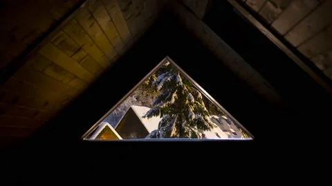 04 window Snowfall visible through the triangular window Stock Footage 150407449
