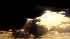 Sun rays are hitting from behind the clouds brightly God salvation and mercy