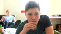 Slow Motion Sequence Of Teenagers Drinking Alcohol At Home
