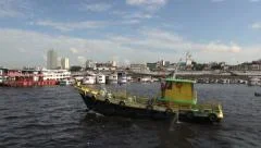 Manaus waterfront yellow and green boat s