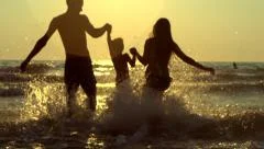 Happy family with a child at the beach